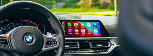 BMW interior with infotainment screen and Apple CarPlay interface on it