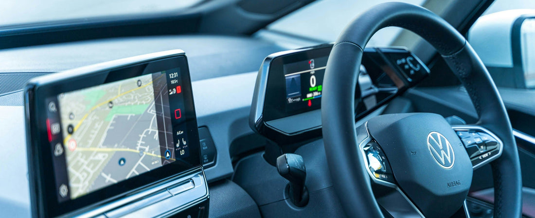 Volkswagen Passat interior with steering wheel and dashboard displaying a navigation system with Apple Carplay Interface through Wireless Carplay Adapter